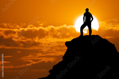 Photo: Man on top of mountain. Man on top of mountain.