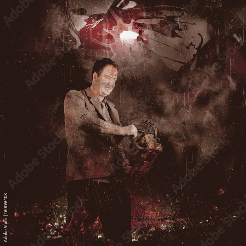 Photo: Scary horror man slinging bloody chainsaw in dark Scary horror man slinging bloody chainsaw in dark