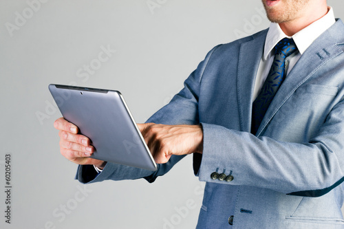 Photo: Businessman using tablet computer Businessman using tablet computer