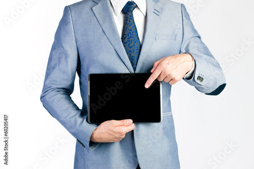 Photo: Businessman presenting tablet computer Businessman presenting tablet computer
