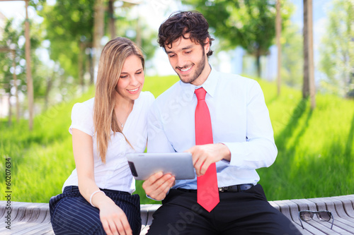 Photo: Couple using a digital tablet Couple using a digital tablet