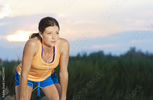 Photo: Female Runner finishing a run Female Runner finishing a run
