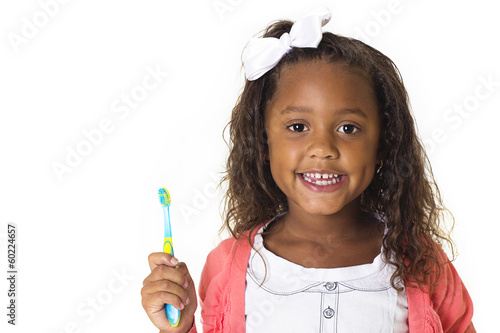 Photo: Cute Little Girl Brushing her teeth Cute Little Girl Brushing her teeth