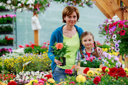 Photo: Flowers center, planting - family shopping plants Flowers center, planting - family shopping plants