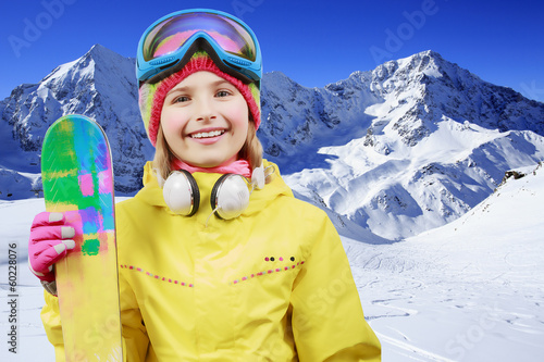 Photo: Ski, winter fun - lovely skier girl enjoying ski holiday Ski, winter fun - lovely skier girl enjoying ski holiday