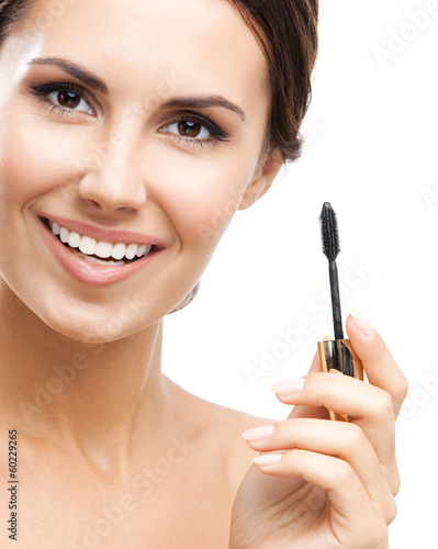 Photo: Young woman with cosmetics brush, isolated Young woman with cosmetics brush, isolated