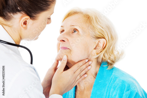 Photo: Doctor Examining Senior Woman's Throat Doctor Examining Senior Woman's Throat