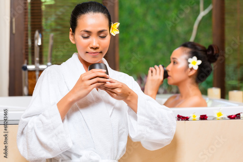 Photo: Indonesian women having wellness bath drinking tea Indonesian women having wellness bath drinking tea