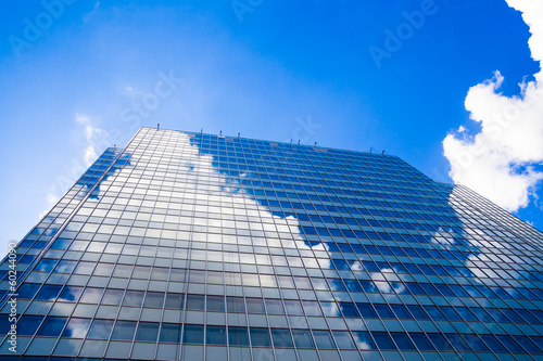 Photo: Abstract building. blue glass wall of skyscraper Abstract building. blue glass wall of skyscraper