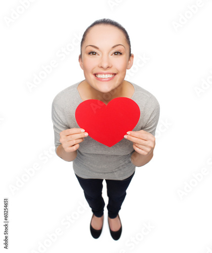 Photo: smiling asian woman with red heart smiling asian woman with red heart
