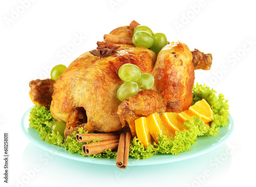 Photo: whole roasted chicken with lettuce, grapes, oranges and spices whole roasted chicken with lettuce, grapes, oranges and spices