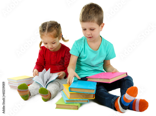 Photo: Little children with books isolated on white Little children with books isolated on white