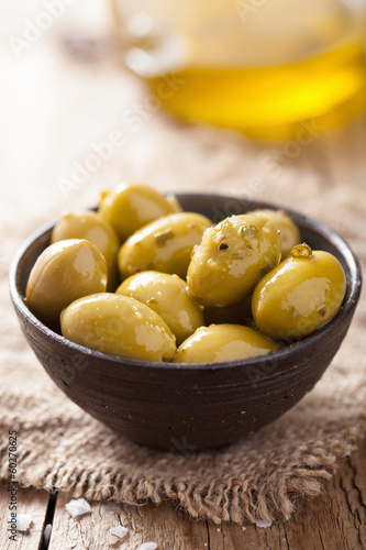 Photo: green marinated olives in bowl green marinated olives in bowl
