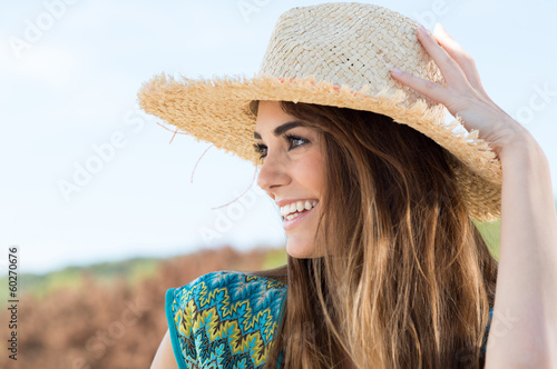 Photo: Young Woman Wearing Straw Hat Young Woman Wearing Straw Hat