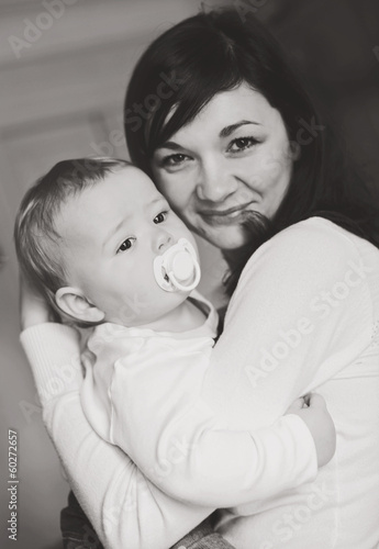 Photo: mother holding baby son mother holding baby son