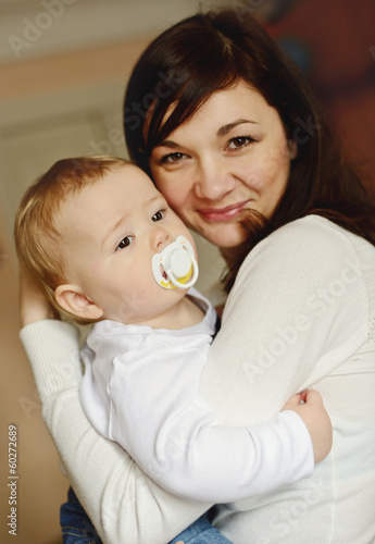Photo: mother holding baby son mother holding baby son