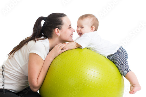 Photo: mother and baby having fun with gymnastic ball mother and baby having fun with gymnastic ball