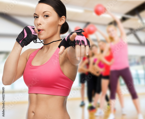 Photo: woman with whistle in gym woman with whistle in gym
