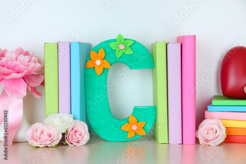 Photo: Shelf decorated with handmade knit letter Shelf decorated with handmade knit letter