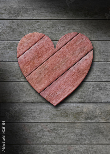 Photo: Red wood heart on gray weathered wooden background Red wood heart on gray weathered wooden background