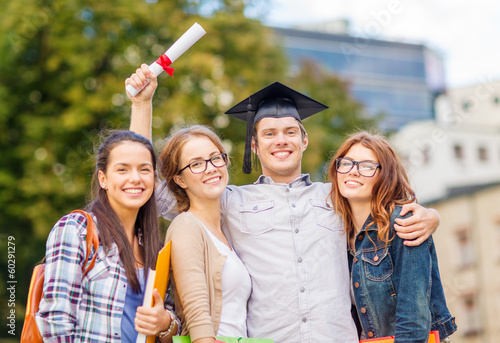 Photo: students or teenagers with files and diploma students or teenagers with files and diploma