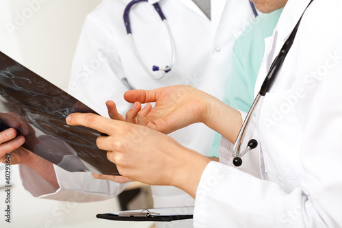 Photo: Doctors looking at scan Doctors looking at scan