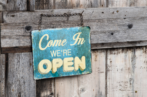 Photo: Vintage open sign on old wooden door Vintage open sign on old wooden door