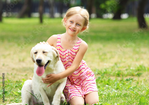 Photo: little girl with her dog little girl with her dog