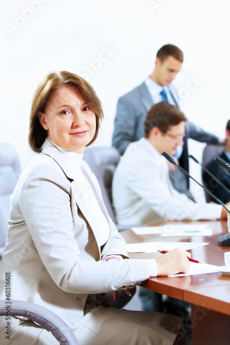 Photo: Three businesspeople at meeting Three businesspeople at meeting