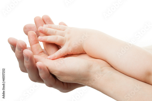 Photo: Family concept.Three hands of the family on white background Family concept.Three hands of the family on white background