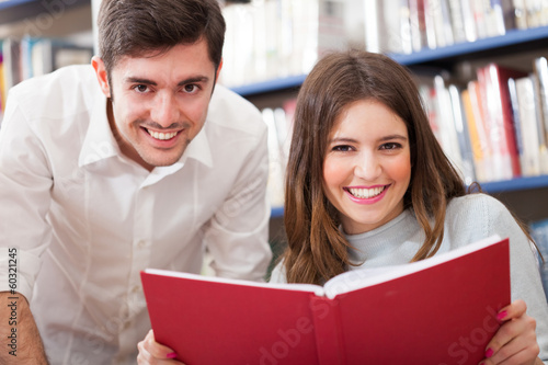 Photo: Friends reading a book Friends reading a book