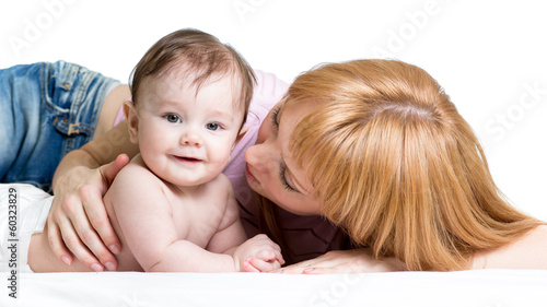 Photo: mother playing with baby girl isolated on white mother playing with baby girl isolated on white