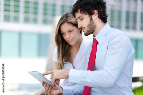 Photo: Business people using a tablet Business people using a tablet