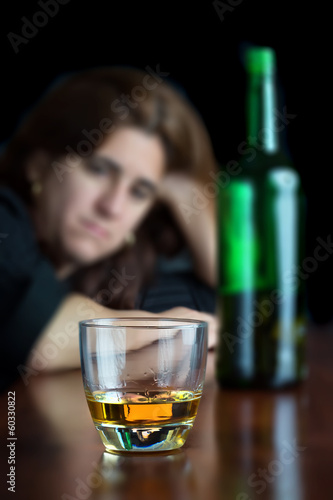 Photo: Drunk hispanic woman drining alone Drunk hispanic woman drining alone
