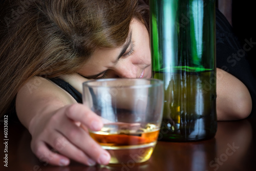 Photo: Drak image of a drunk woman suffering a hangover Drak image of a drunk woman suffering a hangover