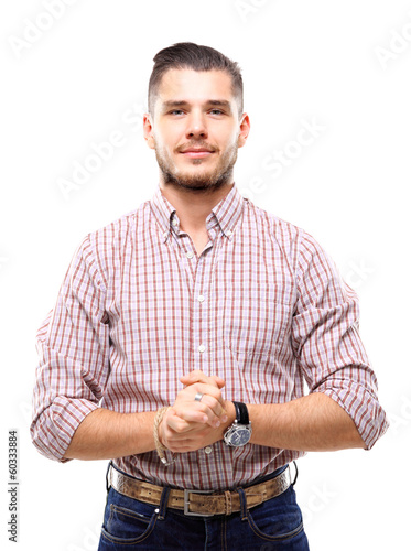 Photo: Casual young man looking at camera with arms crossed Casual young man looking at camera with arms crossed
