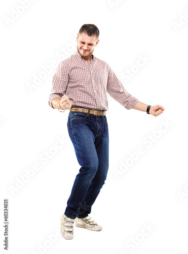 Photo: Excited handsome man with arms raised in success Excited handsome man with arms raised in success