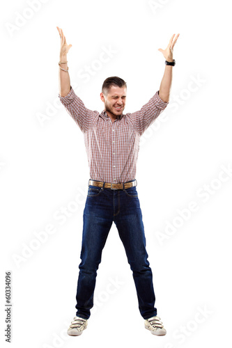 Photo: happy young man celebrating success on white background happy young man celebrating success on white background