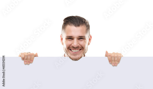 Photo: shocked businessman holding a blank white card board, signboard shocked businessman holding a blank white card board, signboard
