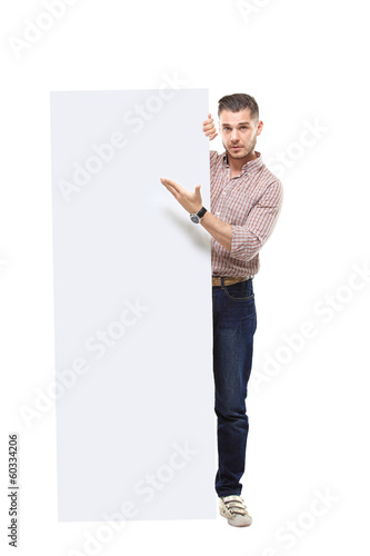 Photo: Happy business man presenting your text isolated on white Happy business man presenting your text isolated on white