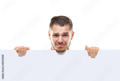 Photo: shocked businessman holding a blank white card board, signboard shocked businessman holding a blank white card board, signboard