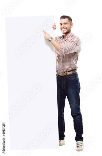 Photo: Happy business man presenting and showing text isolated on white Happy business man presenting and showing text isolated on white