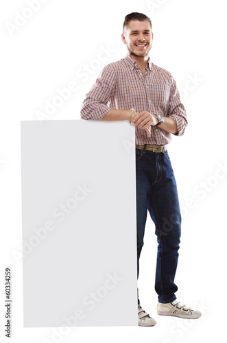 Photo: Happy business man presenting and showing text isolated Happy business man presenting and showing text isolated