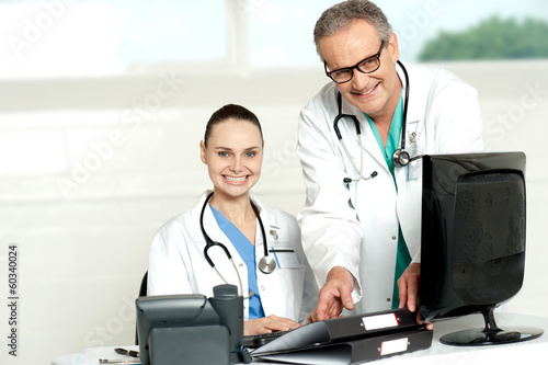 Photo: Two cheerful doctors at hospital Two cheerful doctors at hospital