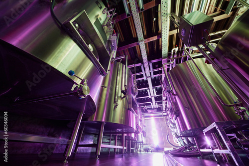 Photo: Rows of tanks at microbrewery, low angle view Rows of tanks at microbrewery, low angle view