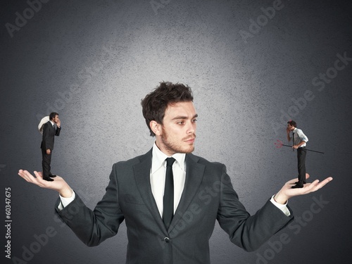 Photo: Businessman and angel or devil Businessman and angel or devil