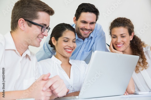 Photo: Business people working on laptop Business people working on laptop