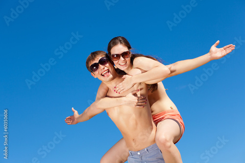 Photo: Happy Young Couple Together On The Beach Happy Young Couple Together On The Beach