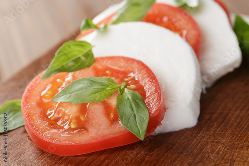Photo: caprese salad made on cutting board caprese salad made on cutting board