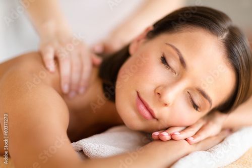 Photo: beautiful woman in spa salon getting massage beautiful woman in spa salon getting massage